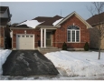Front of home offers a long driveway to fit two cars plus one in the garage.